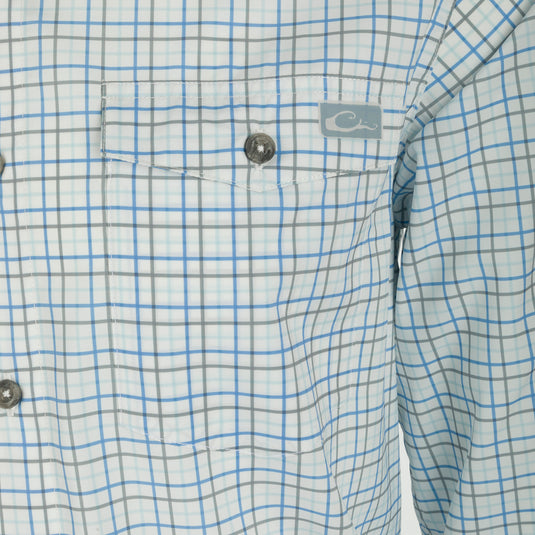 Frat Tattersall Shirt L/S - Close-up of a lightweight, performance fabric shirt with a hidden button-down collar and two chest pockets. Sculpted hem and vented cape back for ease of movement. Features UPF30 sun protection and moisture-wicking technology.