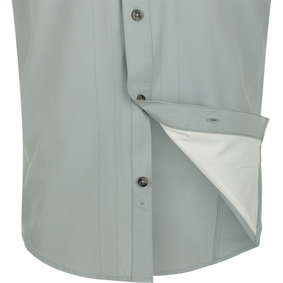 Quarry Wingshooter Trey Shirt S/S: Close-up of technical button-up shirt with hidden collar, vented back, and multiple pockets for outdoor performance.