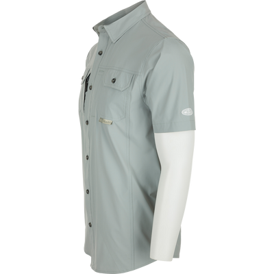 Sideview of Quarry Wingshooter Trey Shirt S/S on mannequin, showcasing hidden collar, chest pockets, and vented back for comfort and style.
