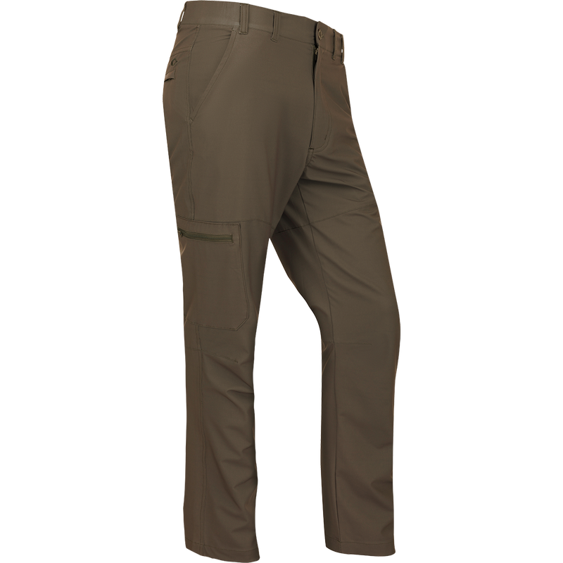 A pair of lightweight, quick-drying Traveler Trek Pants with built-in stretch for comfort. Features include articulated knees, multiple pockets, and a silicone grip waistband. Perfect for your next adventure.