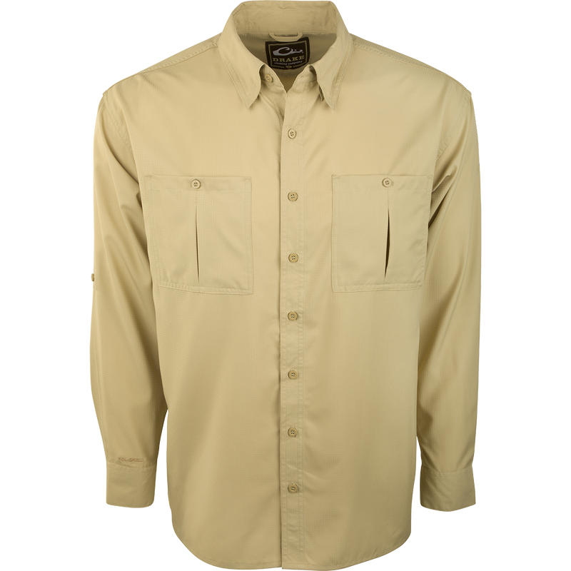 A close-up of the Flyweight Shirt with Vented Back L/S. Features include a logo, button, and pocket. Lightweight, breathable, and quick-drying. Perfect for warm-weather outdoor activities.
