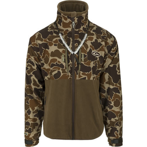 MST Guardian Eqwader Flex Fleece Full Zip Jacket: A camouflage jacket with upper torso and arm protection made of waterproof/windproof/breathable Guardian Flex™ fabric, and a lower body of 350-gram polyester fleece for enhanced breathability under waders. Features include no-water cuff closures, improved fit for range-of-motion, and multiple pockets.