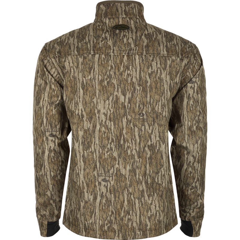 MST Windproof Softshell Jacket: A jacket with a tree pattern, featuring a logo close-up. Crafted from 100% polyester tech shell with a windproof membrane and soft bonded grid-fleece lining. Adjustable drawcord waist and zippered underarm vents for versatile wear. Magnattach™ vertical chest pockets and lower slash pockets for secure storage.