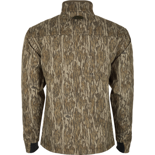 MST Windproof Softshell Jacket: A jacket with a tree pattern, featuring a logo close-up. Crafted from 100% polyester tech shell with a windproof membrane and soft bonded grid-fleece lining. Adjustable drawcord waist and zippered underarm vents for versatile wear. Magnattach™ vertical chest pockets and lower slash pockets for secure storage.