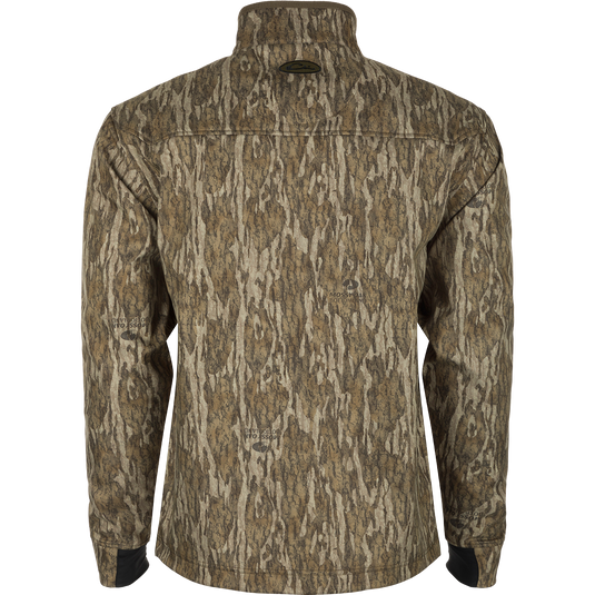 MST Windproof Softshell Jacket: A jacket with a tree pattern, featuring a logo close-up. Crafted from 100% polyester tech shell with a windproof membrane and soft bonded grid-fleece lining. Adjustable drawcord waist and zippered underarm vents for versatile wear. Magnattach™ vertical chest pockets and lower slash pockets for secure storage.