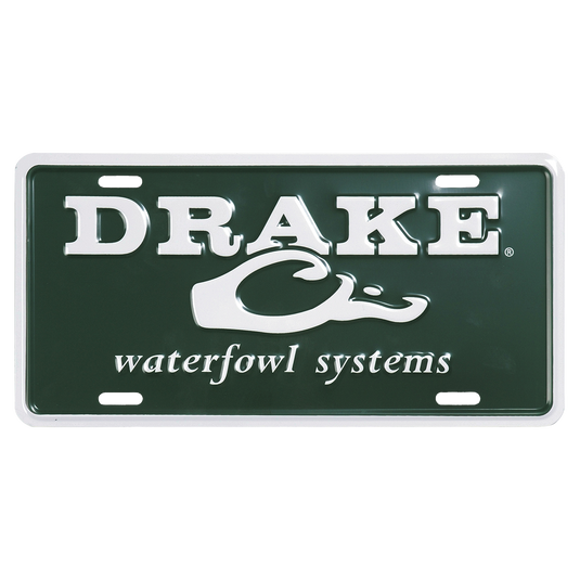 A close-up of the Drake License Plate, featuring white text on a green background and a logo. Perfect for showing your love of hunting and Drake Waterfowl Systems.