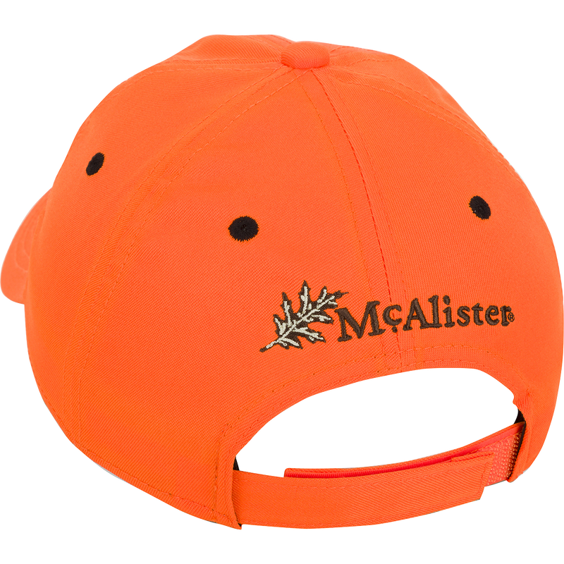 McAlister Upland Circular Patch Twill Cap: A low-profile ball cap with an orange fabric, black dots, and a leaf. Adjustable Velcro closure for a perfect fit.