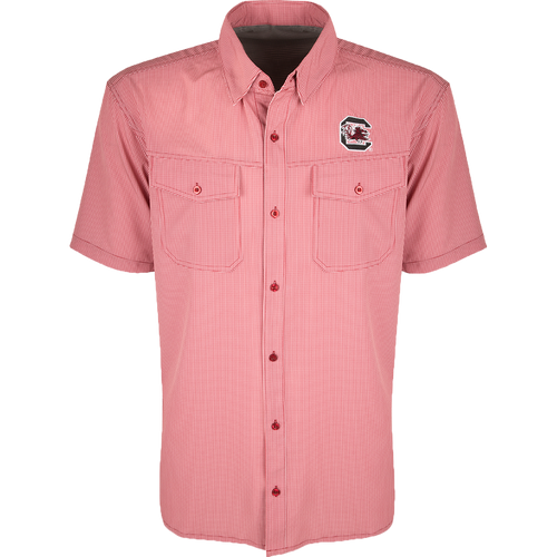 South Carolina S/S Traveler's Shirt - A lightweight, breathable plaid shirt with four-way stretch for freedom of movement. Features moisture-wicking fabric, button flaps on chest pockets, and a South Carolina logo embroidered on the left chest. Ideal for early season football games or weekend tailgates with friends.