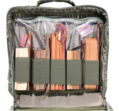 Ol' Tom Treasure Chest, a bag with wood pieces, red and yellow cable, plastic container, hotdog, white object, piece of wood, brown leather case, and grey fabric.